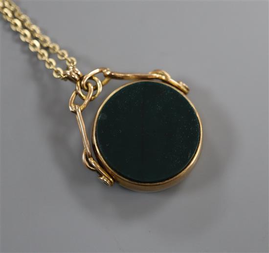 A 9ct gold swivel fob seal with carnelian and bloodstone matrix on 9k fine chain, gross 9.2 grams.